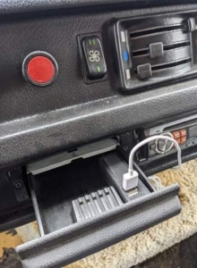 Mercedes 207D truck ashtray with hidden phone charger