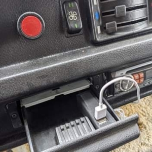 Mercedes 207D truck ashtray with hidden phone charger