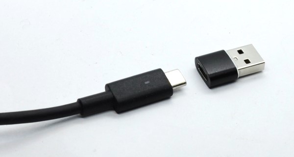 Adapter plug to connect USB-C cable to USB port